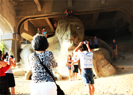 People taking photos of the Fremont Troll