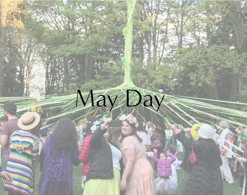 People weaving ribbons around a maypole for May Day